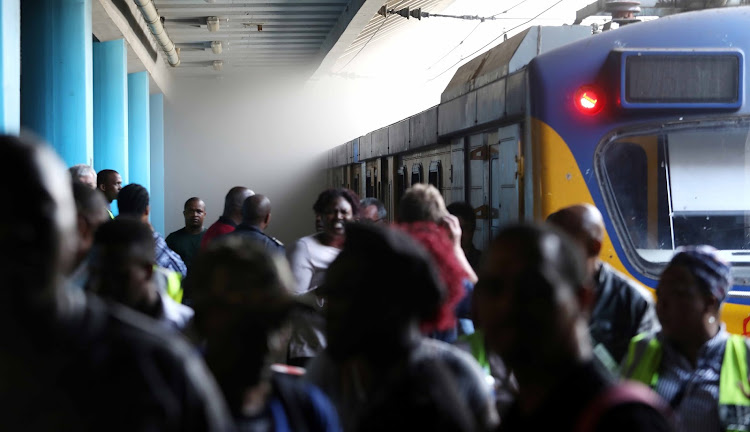 Passengers were evacuated from platforms at Cape Town train station after two trains were set alight.
