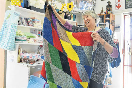 HELPING OTHERS: Toni Krull, of Hands On, holds one of the blankets made by her knitting club Picture: INGANATHI WILLIAMS