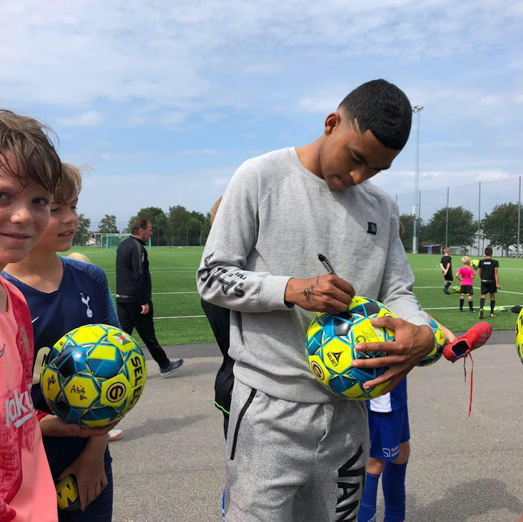 Keanin Ayer signing balls in August 2019.