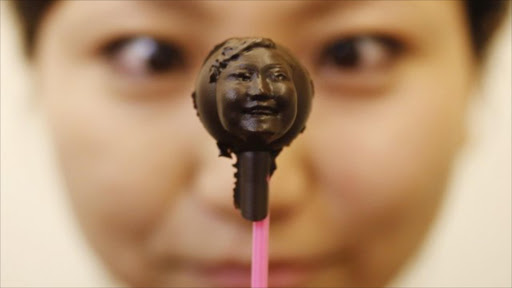 Miniature chocolate replicas of face. File photo