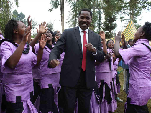Meru Governor Peter Munya joins dancers in adance after the opening of Kiarago Health Centre in Imenti Southon July 29,2016./MUTHOMI MWENDA