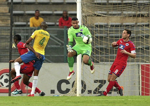 Ronwen Williams, centre, of SuperSport United, announced his return from injury with fine saves against Downs.