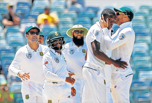 MAN OF THE MOMENT: South Africa’s Kagiso Rabada is kissed by team captain Faf du Plessis as they celebrate dismissing Australia’s Mitchell Starc at the Waca Ground in Perth, Australia, yesterday. Rabada steered the Proteas to victory in the first of three Tests in this series Picture: REUTERS