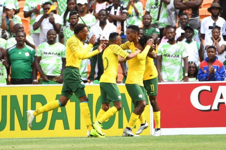 Bafana Bafana celebrate during the match between South Africa and Nigeria at FNB Stadium on November 17, 2018 in Johannesburg, South Africa.