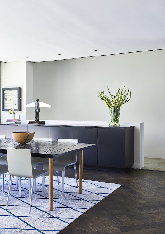 The 'Jozi Table' dining table is a GOET design, featuring a laser-cut steel top with a pattern based on a map of Johannesburg.