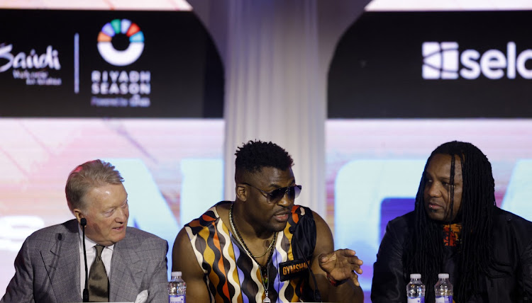 Promoter Frank Warren, left, during a press conference with Francis Ngannou (centre) and Dewey Cooper. Picture: ANDREW COULDRIDGE/ACTION IMAGES via REUTERS