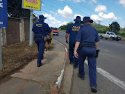 Police Search and Rescue Unit officers during a search for missing baby Siwaphiwe on Saturday morning.