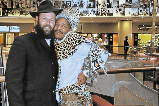 Phakama Shembe, right, leader of the Gauteng faction of the Shembe Church, with Farrel Shalkoff, chairman of Bibleo, who will provide the church with the Tanach, an English version of the Hebrew Bible, comprisingthe Torah, Prophets and sacred writings, including Psalms, Proverbs and historical books