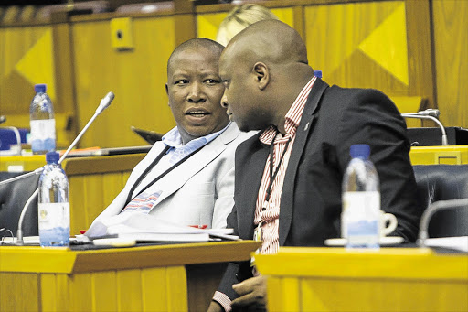 NEEDLE AND THREAD: EFF leader Julius Malema and party spokesman Floyd Shivambu at a meeting of the parliamentary committee convened to review the adequacy of President Jacob Zuma's response to the public protector's report on the 'security upgrading' of his Nkandla home