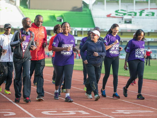GEARING UP: First Lady Margaret Kenyatta during a warm-up and training session at Kasarani Safaricom Stadium in preparation for the forthcoming First Lady's Half Marathon. She was joined by some local media personalities. Photo/PSCU