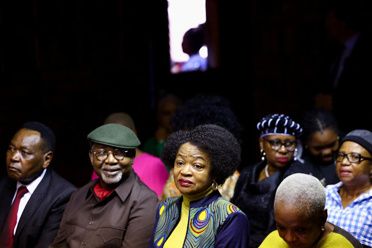 South Africa's former National Assembly speaker Baleka Mbete sits next to former defence minister Charles Nqakula, husband of former National Assembly speaker Nosiviwe Mapisa-Nqakula, who faces charges relating to corruption, at the Pretoria magistrate's court on April 4 2024.