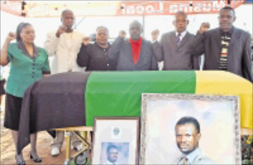 LAST POST: Musina mayor Caroline Mahasela, MECs Soviet Lekganyane, Pinkie Kekana, Pandelani Ramagoma, Pitsi Moloto and Vhembe mayor Shumani Ravhuanzwo salute Alderman David Phologa. 11/05/09. Pic. Alex Matlala. © Sowetan.