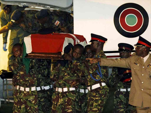 Members of the Kenya Defence Forces carry the casket of a comrade serving in the African Union Mission in Somalia (AMISOM), who were killed during an attack last week on a military base in the west of Somalia near the Kenyan border by Somalia's al Shabaab Islamist group, after their remains arrived at the Wilson airport during a military parade, in Kenya's capital Nairobi, January 18, 2016. REUTERS/Thomas Mukoya