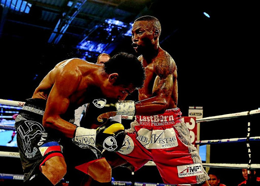 Zolani Tete (in red shorts), seen here in action against Arthur Villanueva, has been nominated among the top five in the Sports Star of the year award. /Nigel Roddis/Getty Images