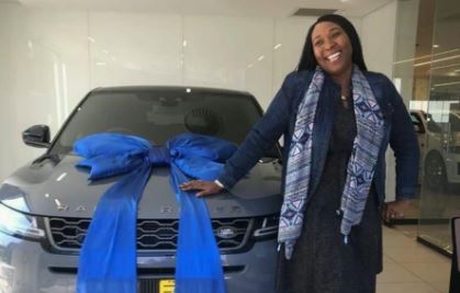 Cheryl Modise poses with her brand new Range Rover Evoque.