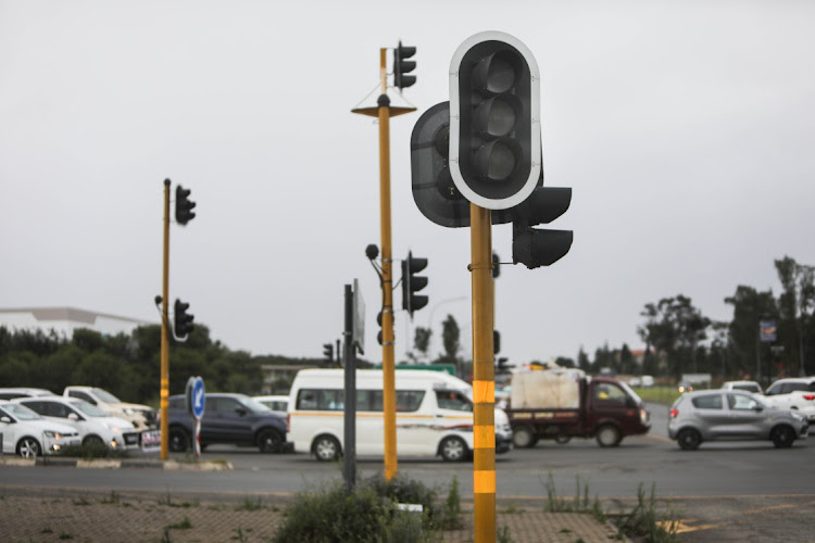 Traffic builds around traffic lights that are off due to load shedding, 07 December 2022, in Johannesburg South.