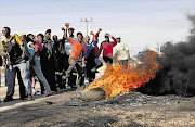 Protesters block a road leading to Cassel. The Northern Cape has been hit by protests over untarred roads Picture: LAUREN MULLIGAN