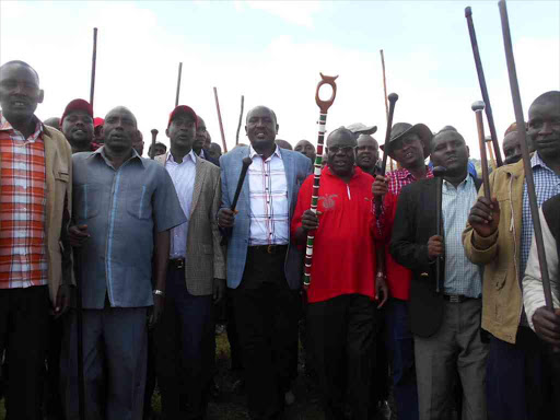 Narok West MP Patrick Ntutu (Second Left), former Devolution PS John Konchellah, former Internal Security minister Julius Sunkuli and their supporters match in Kilgoirs town after officially opening a JP office on Thursday /EDWIN NYARANGI