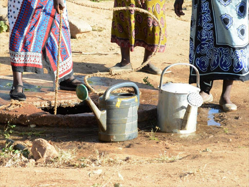 Residents of Kihoto estate in Naivasha draw water from a shallow borehole in the area which is the only source of water.