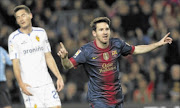 ON THE DOUBLE
      : Barcelona's Lionel Messi celebrates a goal against Zaragoza. 
      pHOTO: REUTERS
