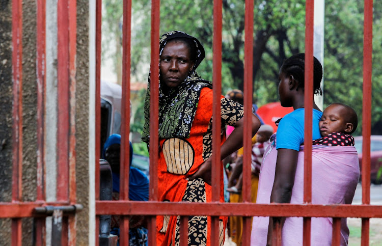 Relatives of followers of a Christian cult named as Good News International Church, who believed they would go to heaven if they starved themselves to death in Shakahola, stand outside the steel gate of the Malindi sub district hospital mortuary in Malindi, Kilifi county, Kenya April 27, 2023.