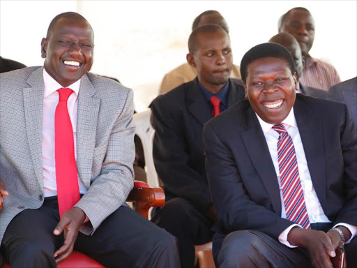 DP William Ruto in a jovial mood with Water CS Eugene Wamalwa during the Butsotso cultural festival held at Ematiha primary school in Kakamega county on December 31. Photo/DPPS