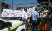 Occupants of Enduduzweni Skills Centre preventing the police from accessing the facilities.