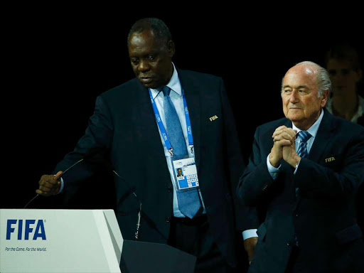 A file photo of former CAF president Issa Hayatou (L) with former FIFA President Sepp Blatter at the 65th FIFA Congress in Zurich, Switzerland, in May 29, 2015. /REUTERS