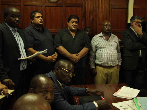 Lawyer Steve Kimathi with Imperial Bank directors, from l-r Nashir Haideraii Jesa, Zurfikar Haideraii Jesa, James Kaburu and Nargius Azixz Jessa at Milimani law court.Photo/PHILIP KAMAKYA