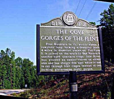 Pine Mountain to the south makes a complete loop forming a beautiful basin 4 miles in diameter known as "The Cove." It is joined on the south by Oak Mountain, another hard quartz ridge. Flint...