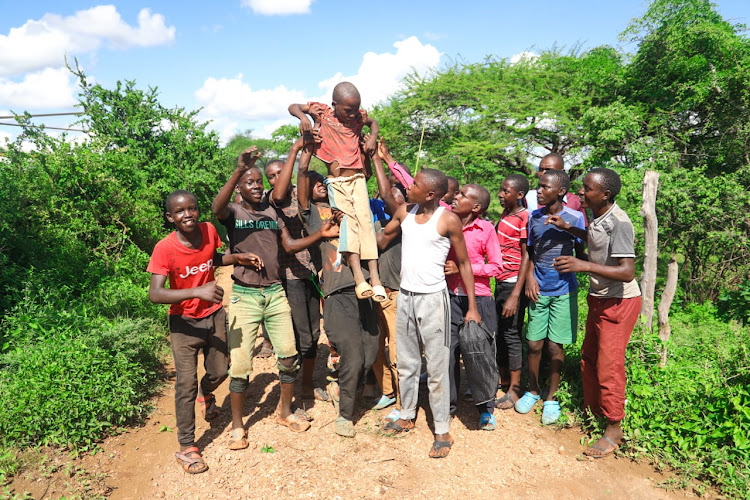 Five-year-old Mutuku Kioko embraced by his family upon being saved by the NPS after he was marooned by floods at Nduani in Yatta, Machakos County on April 23, 2024.