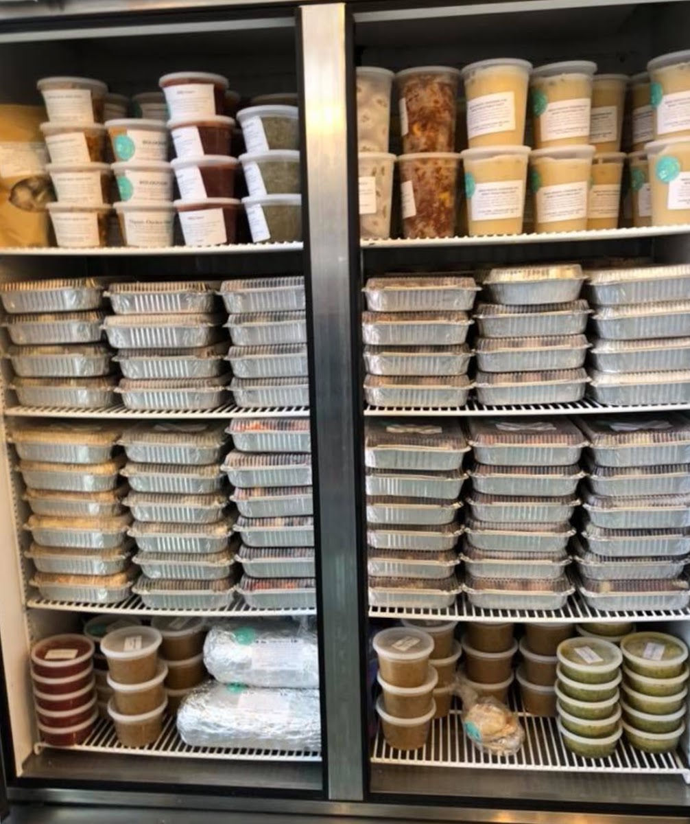 Freezer full of prepared meals for takeout. From soups to sauces and dinner entrees.