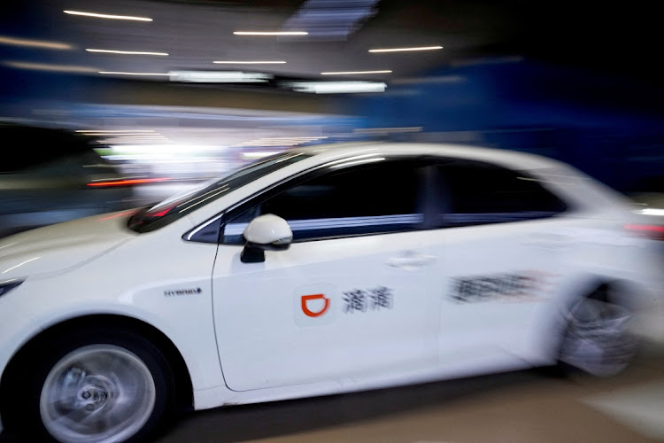 A car of Chinese ride-hailing service Didi is seen at the Shanghai Hongqiao International Airport in Shanghai, China on August 14, 2023. Picture: REUTERS/ALY SONG