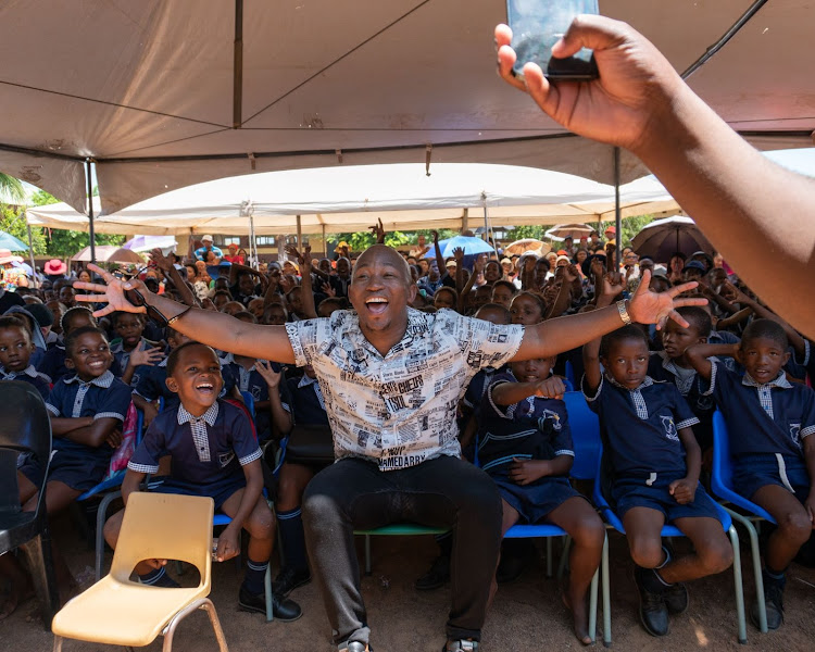 Khuli Chana with the kids from Dimapo Primary School.