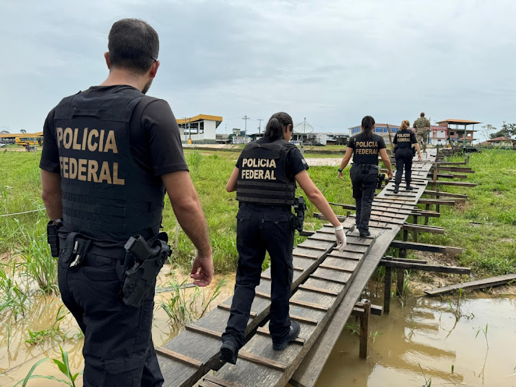 Federal Police officers conduct a raid in a port during the Turquesa Operation, in Benjamin Constant Brazil November 30, 2023.