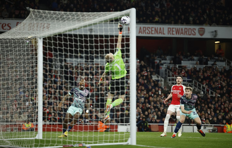 Brentford's Nathan Collins has his shot saved by Arsenal's Aaron Ramsdale in the Premier League match at Emirates Stadium in London on Saturday night.