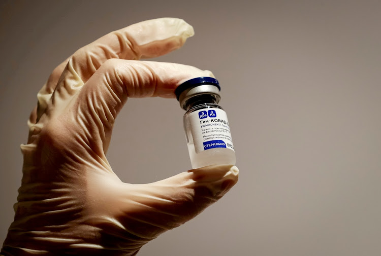 A medical specialist holds a vial of Sputnik V vaccine against the coronavirus in a department store in Moscow, Russia.