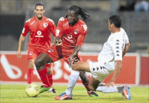 AWOL: Benjani Mwaruwari of Chippa in a tussle with Bevan Fransman of SuperSport. Photo: Gallo/Getty Images