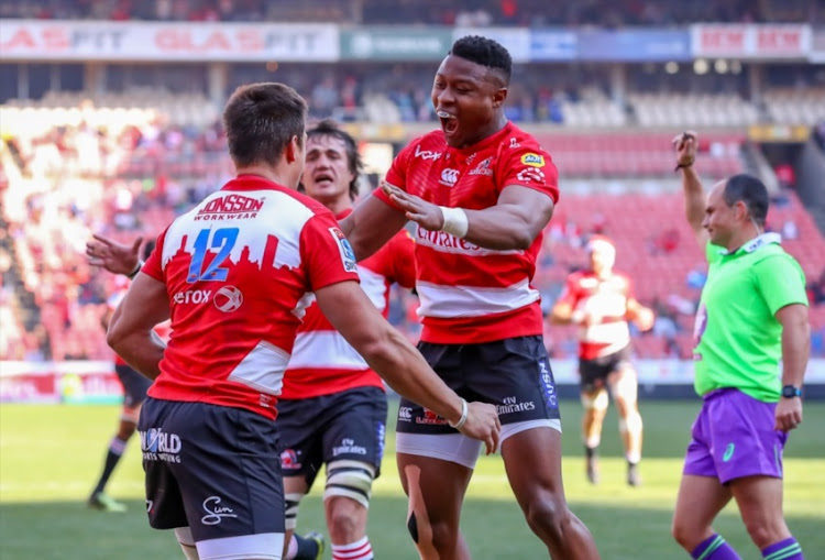 Aphiwe Dyantyi of the Emirates Lions on his way to congratulate try scorer Harold Vorster of the Emirates Lions during the Super Rugby quarter final match between Emirates Lions and Jaguares at Emirates Airline Park on July 21, 2018 in Johannesburg, South Africa.