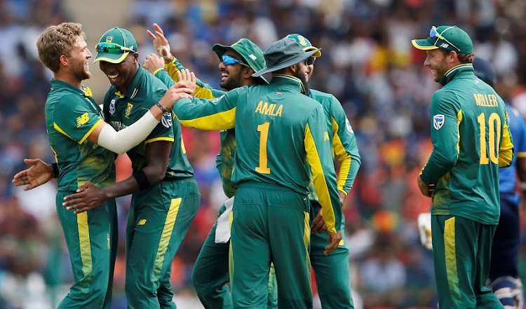 South Africa's Willem Mulder (L) celebrates with his teammates Lungi Ngidi (2nd L), Tabraiz Shamsi (C), Hashim Amla (1) and David Miller (R) after taking the wicket of Sri Lanka's Thisara Perera (not pictured).