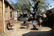 Brothers Parkson and Solomon Muvi in the yard of their home. 