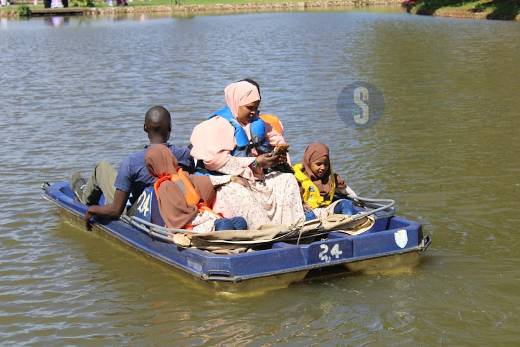 A family boat riding during the Eid Mubarak celebrations at Uhuru Park, Nairobi on April 10, 2024.