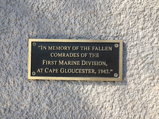 "IN MEMORY OF THE FALLEN  COMRADES OF THE  FIRST MARINE DIVISION AT CAPE GLOUCESTER, 1943."
