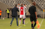 Ajax Cape Town striker Tendai Ndoro celebrates with his head coach Muhsin Ertugral during the Absa Premiership match against Platinum Stars at Cape Town Stadium on January 12, 2018 in Cape Town, South Africa.