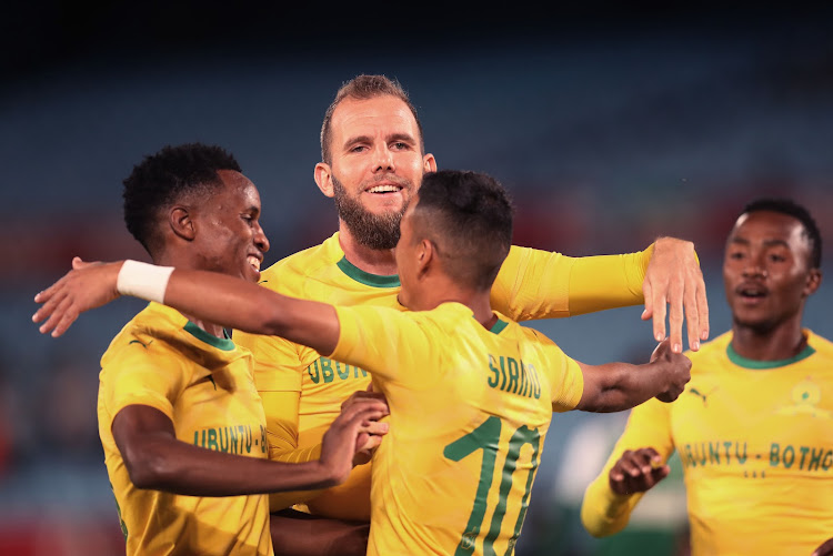 Mamelodi Sundowns' New Zealand striker Jeremy Brockie (C) celebrates with teammates after scoring the opening goal in the 5-1 Caf Champions League group stage qualifying second leg match against Leones Vegatarianos at Loftus on December 5 2018. Sundowns won 71 on aggregate.