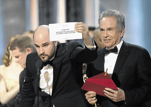TWO FILMS CUT FREE: Warren Beatty breaks the bad news to 'La La Land' producer Jordan Horowitz.