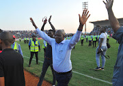 Black Leopards ownder and chairman David Thidiela celebrate with the fans in the stands after his team won promotion to the Premier Soccer League (PSL) at Thohoyandou Stadium on May 30 2018.