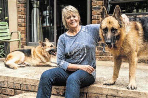 WATCHDOG: Former National Prosecuting Authority prosecutor Glynnis Breytenbach, now a DA member of parliament, with her German shepherd dogs on her Gauteng smallholding