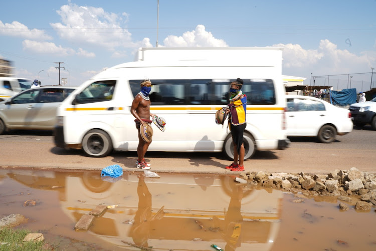 Thando Mahlangu and his girlfriend Nqobile Masuku run a business selling items adorned with painted traditional prints. These items are sold in and around KwaMahlanga, Mpumalanga.