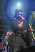 WOWING THE CROWDS: Thandiswa Mazwai performs at the Cape Town  Jazz Festival
        on Saturday. 
      Photos: Veli Nhlapo